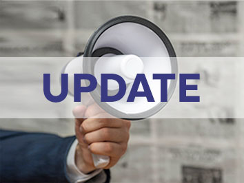 A hand holding a bullhorn with the word "Update" in front of image.